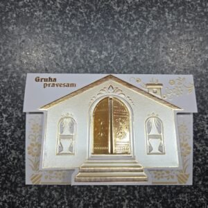 Housewarming invitation featuring a white and gold embossed design shaped like a house