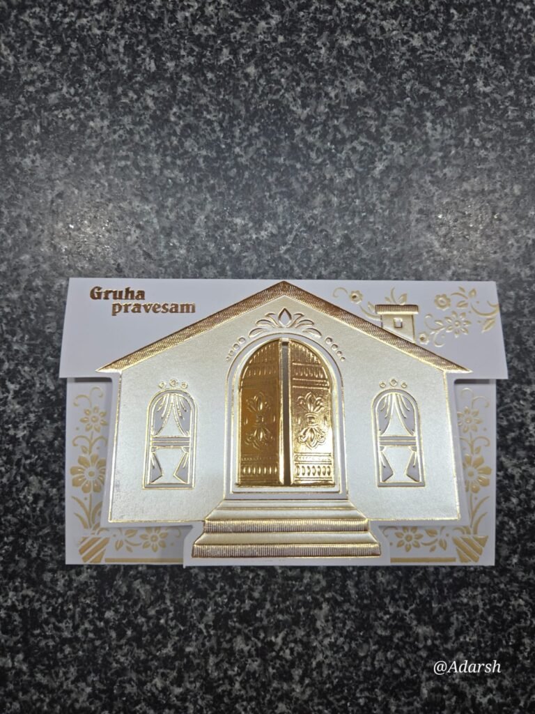 Housewarming invitation featuring a white and gold embossed design shaped like a house