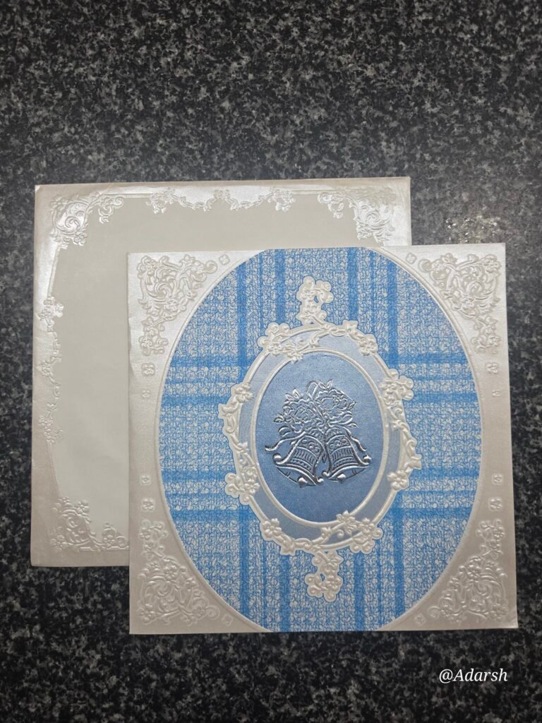 A regal cream and royal blue wedding Card