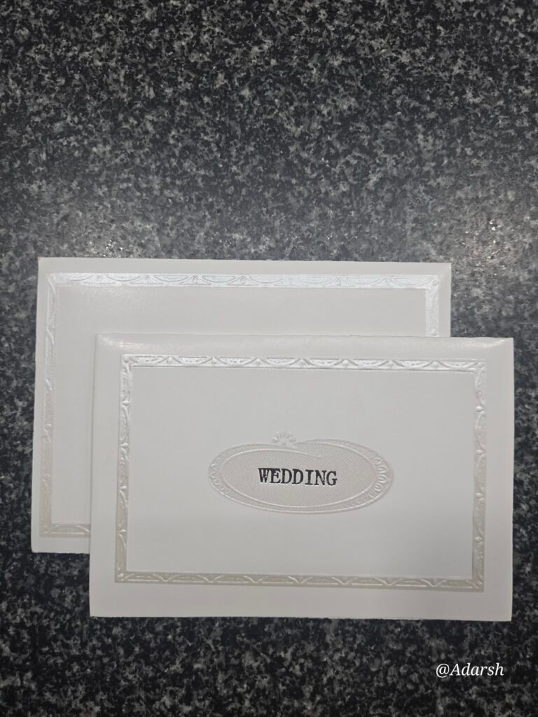 A minimalist and sophisticated stark white wedding Card