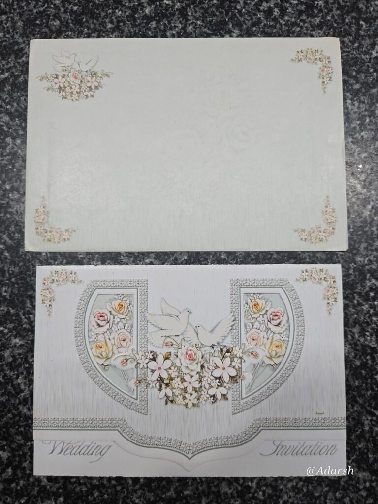 An elegant white gatefold wedding Card