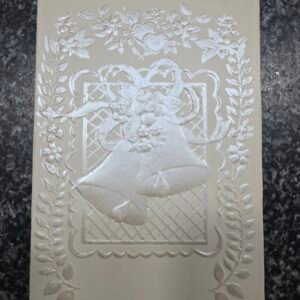 An elegant, embossed cream-colored Christian Card