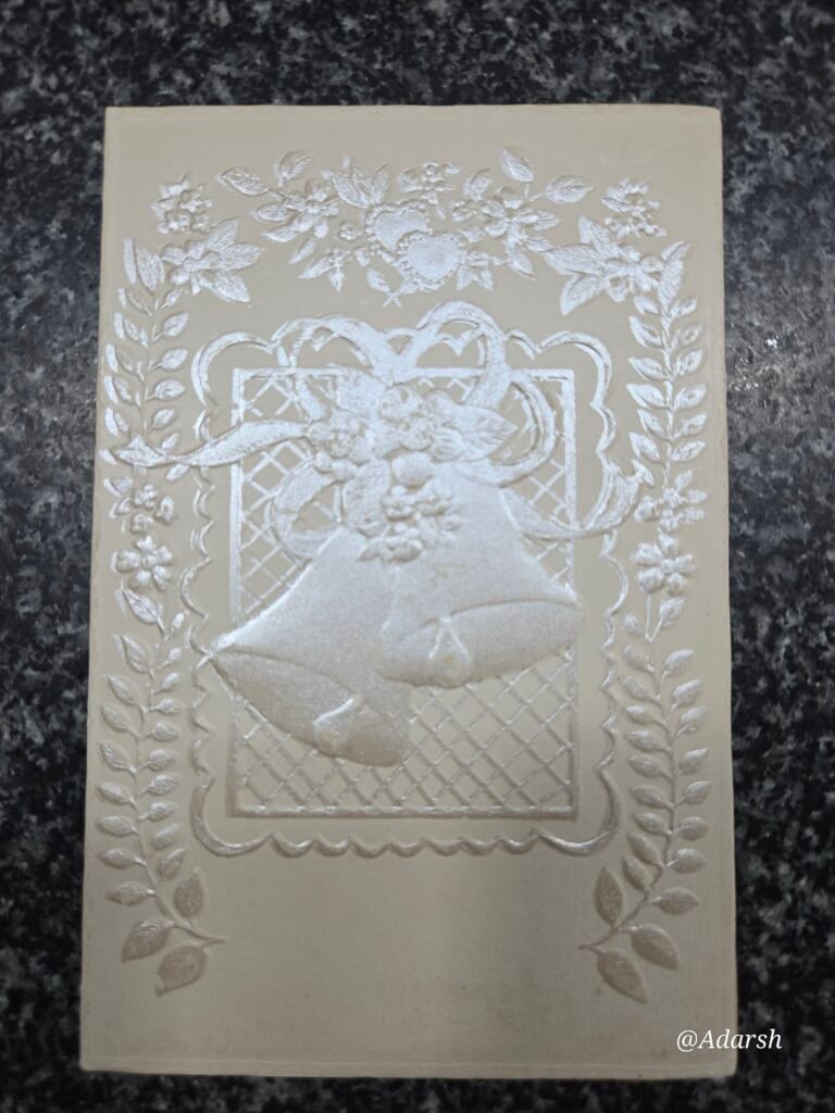 An elegant, embossed cream-colored Christian Card