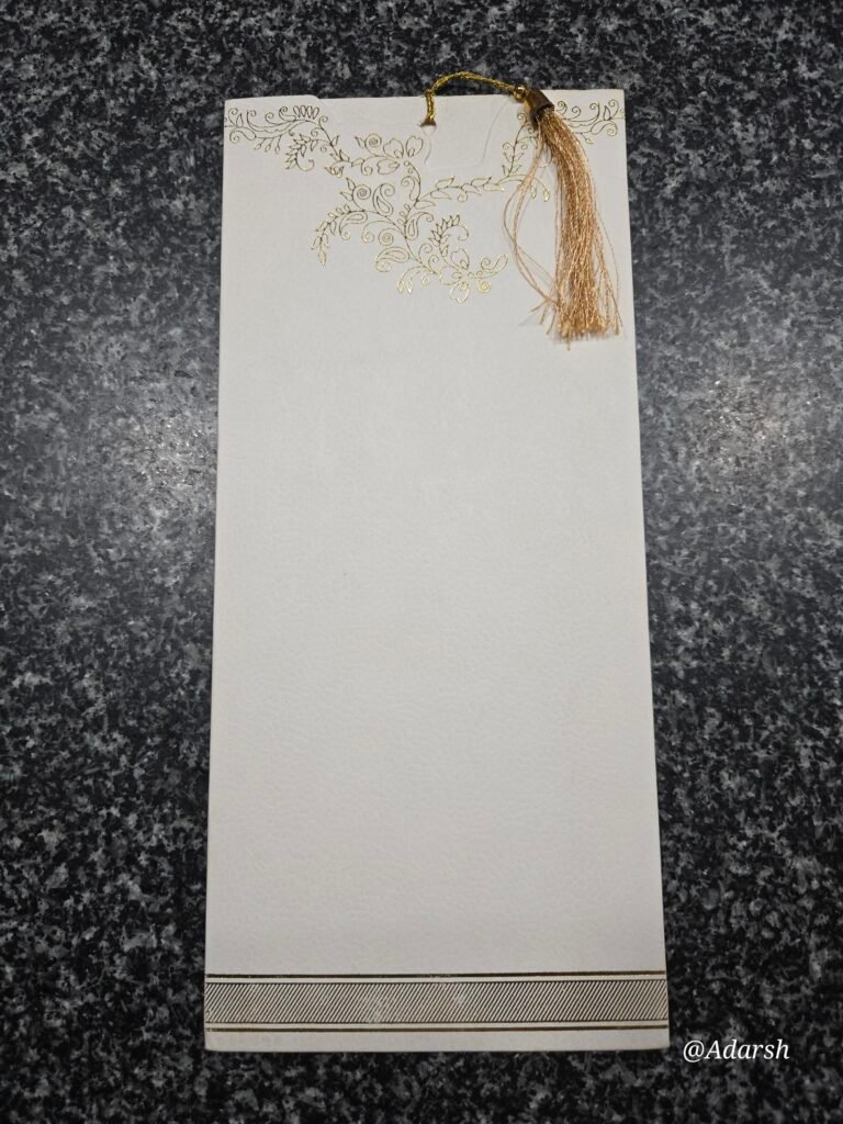 An off-white textured Wedding card with Tassel