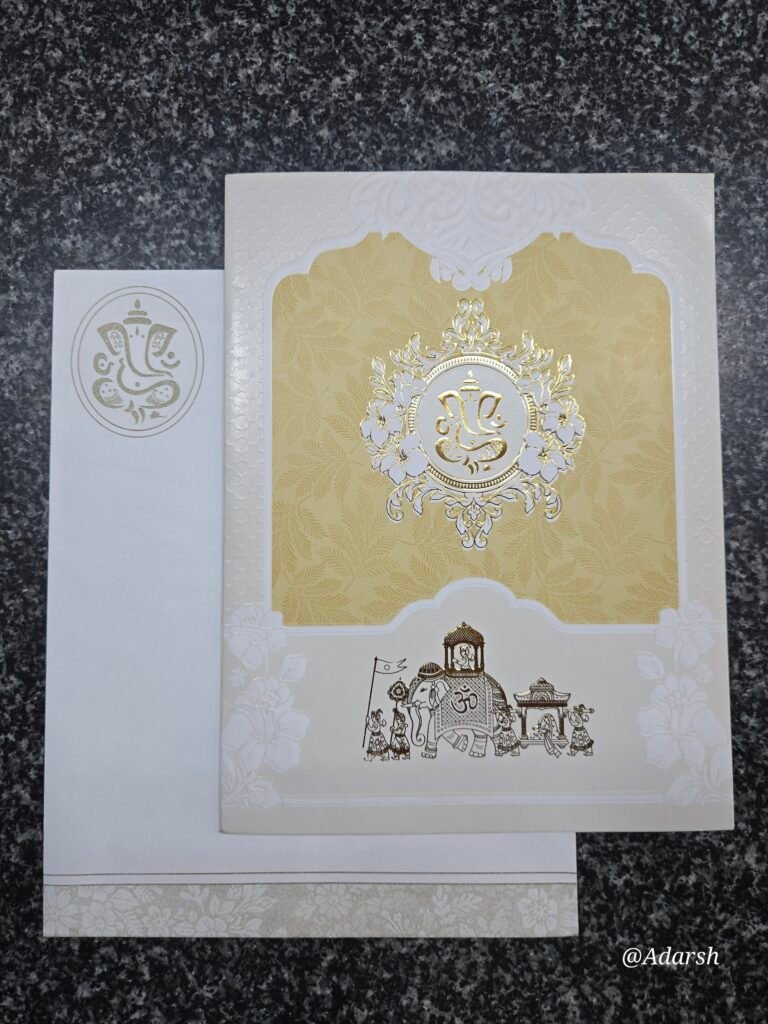 An elegant cream-gold palette and a royal Baraat theme Card