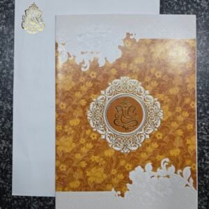 An elegant mustard-gold floral pattern and Ganesha motif Wedding Card