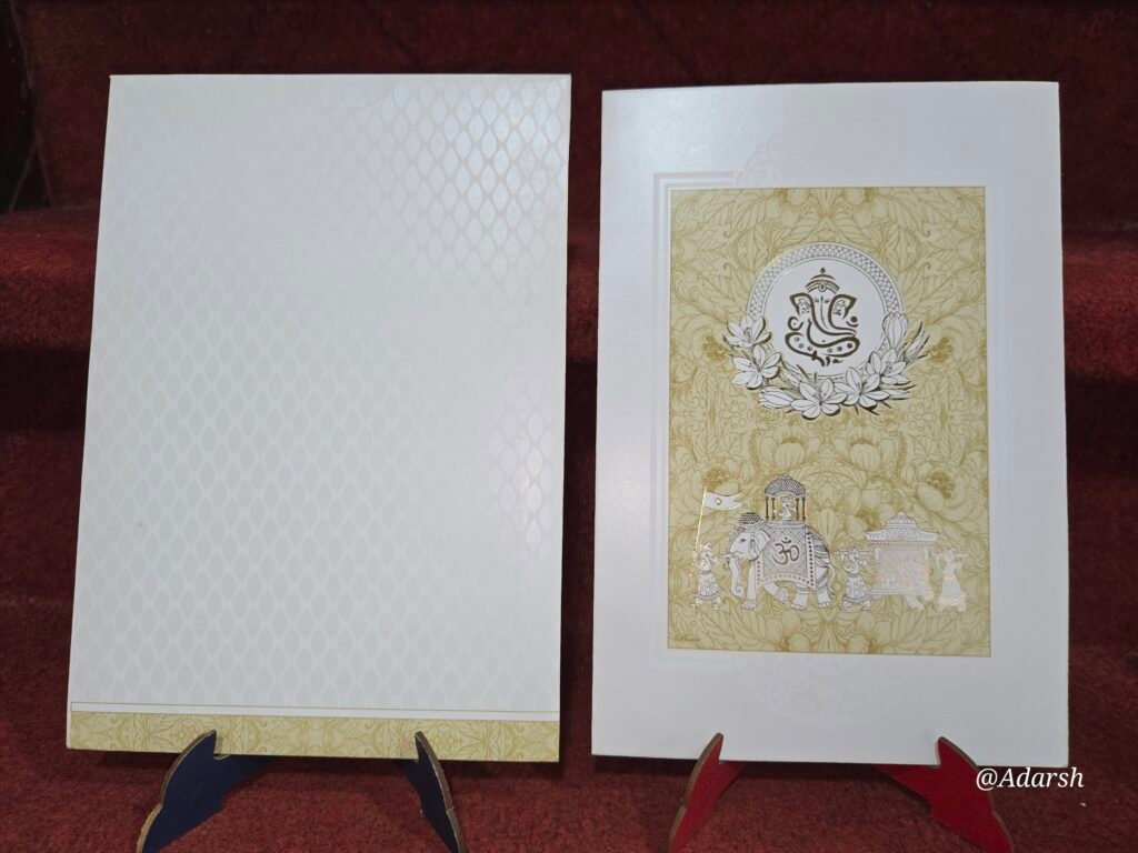 Beige and White Floral Baraat Hindu Wedding Invitation Card.