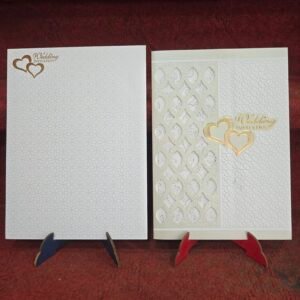 Laser-cut hearts wedding invitation cards.