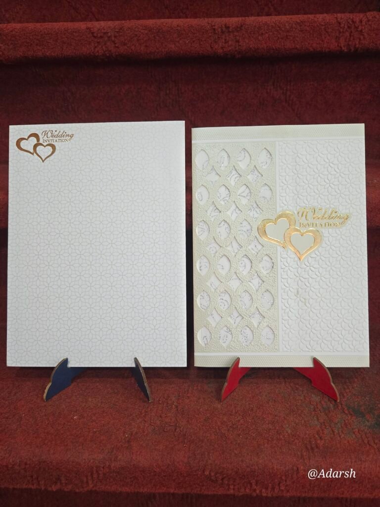 Laser-cut hearts wedding invitation cards.