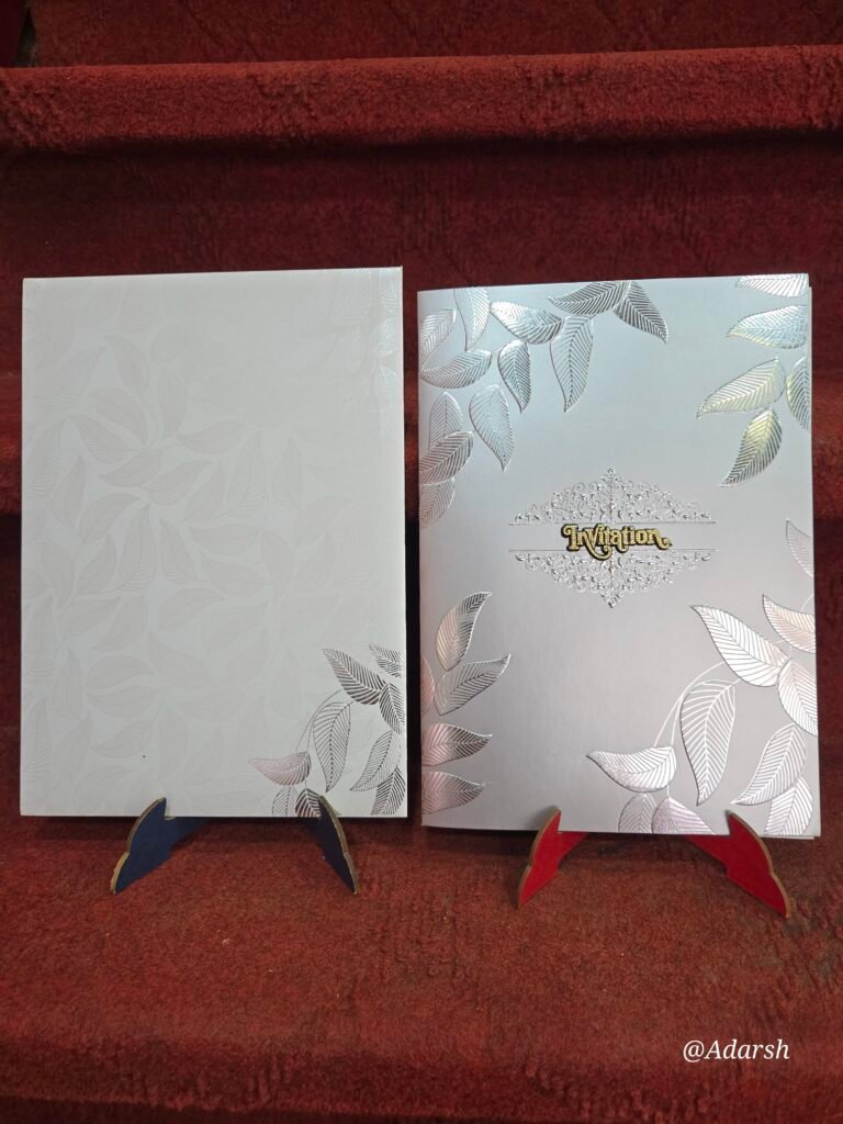 White and Silver Embossed Leaf Design Invitation Card.