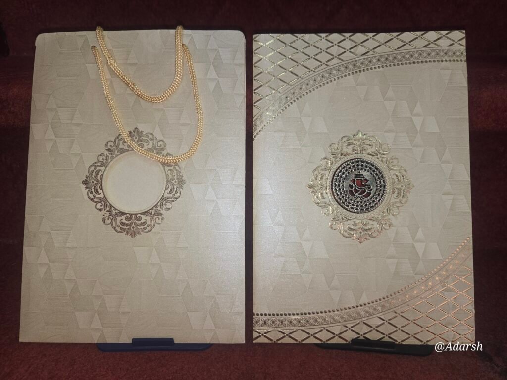 Premium Metallic Gold Ganesha Bag-Style Wedding Invitation Card.