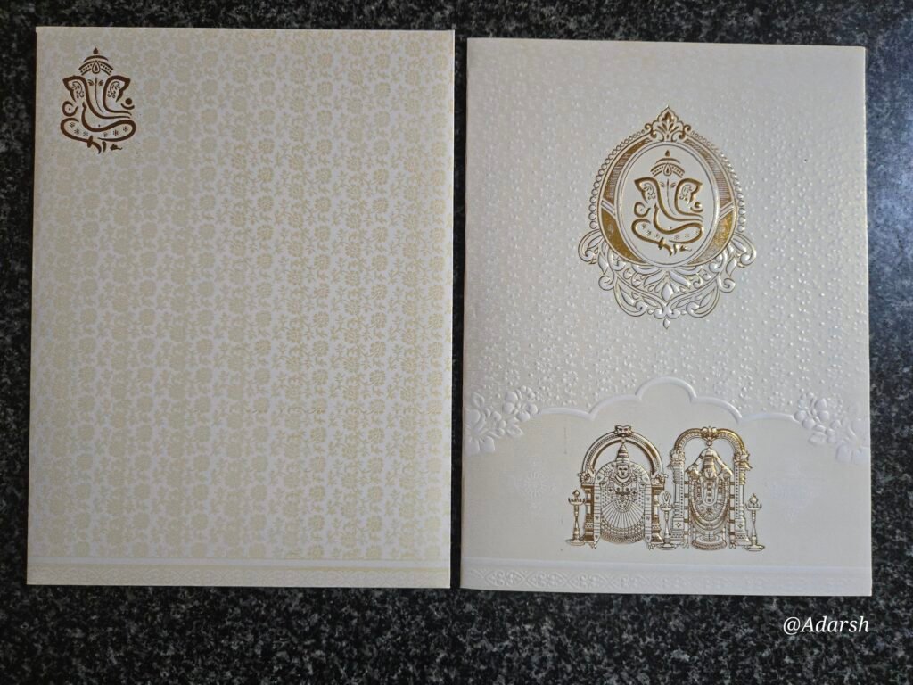 White Shimmer Embossed Tilak Ganesha Balaji Wedding Card