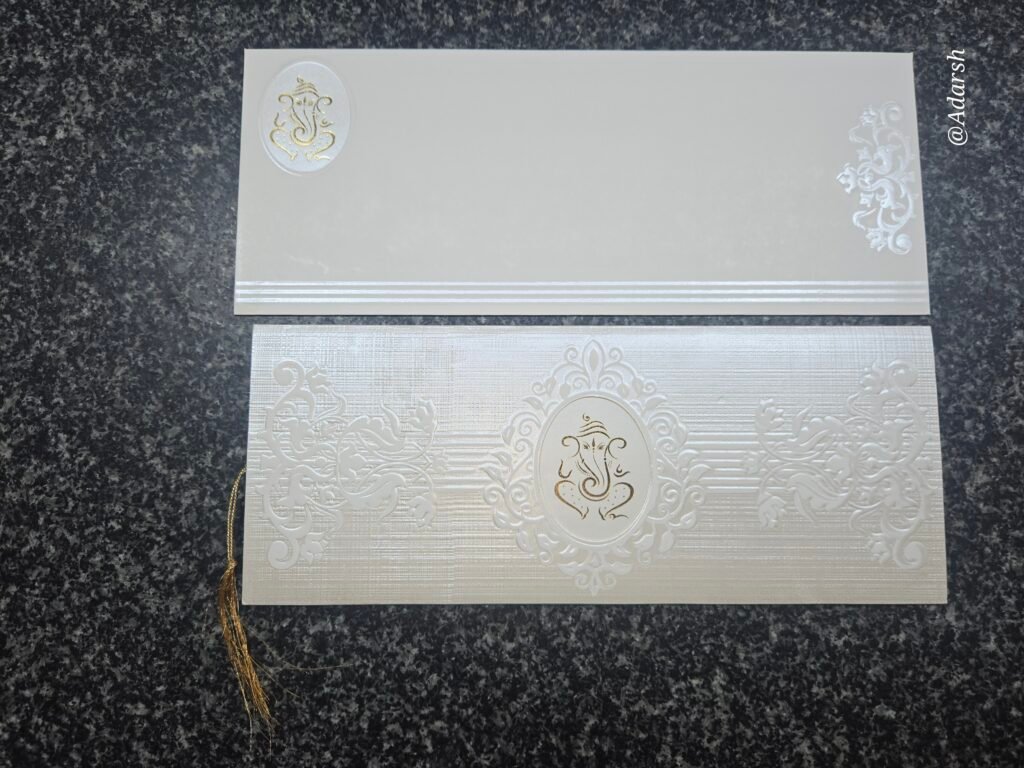 Blind-Embossed Cream Shimmer Ganesha Wedding Invitation Card