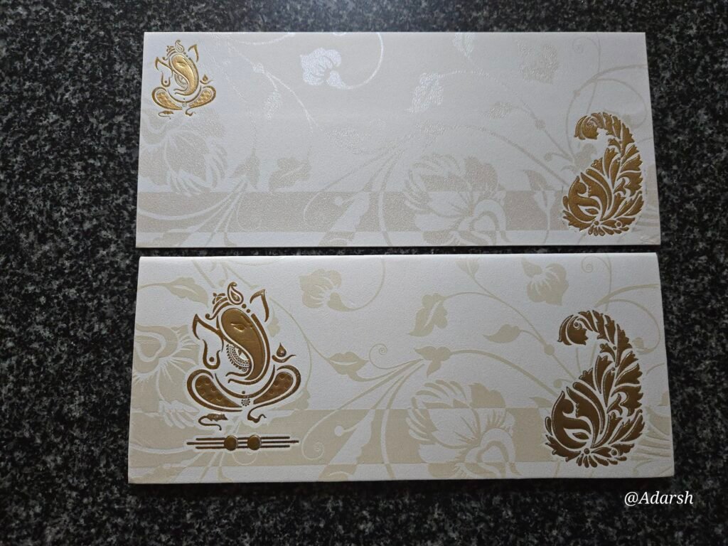 Off-White Shimmer Ganesha Floral Wedding Invitation Card