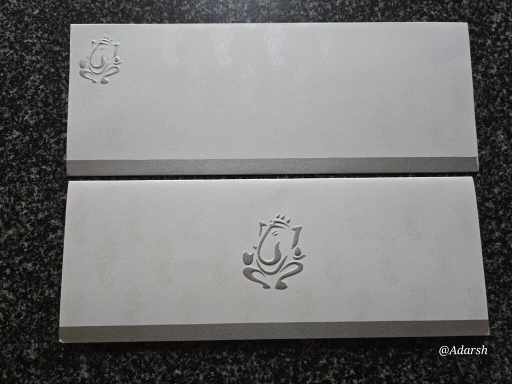 Blind-Embossed Silver Shimmer Ganesha Wedding Invitation Card